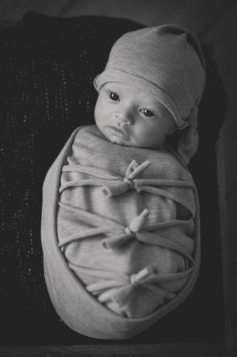 newborn baby photographed wrapped up 